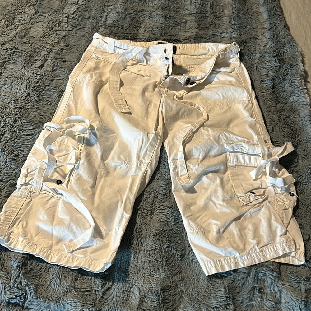 Ivory color, capris style cargo shorts.